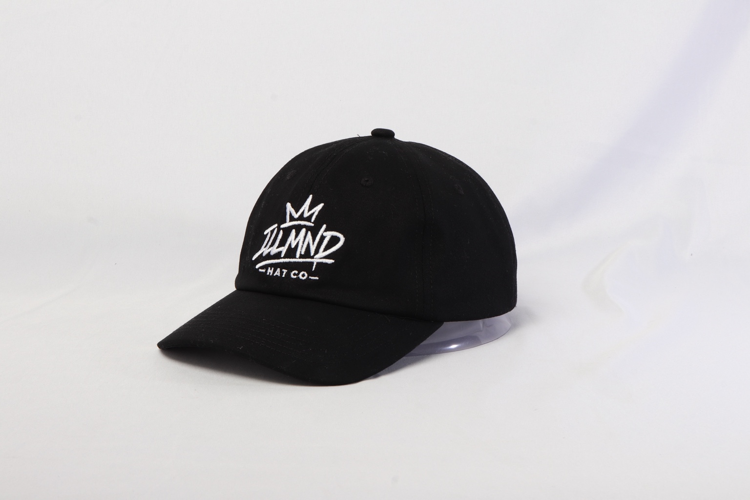 Genesis Cap in black, three-quarter angle